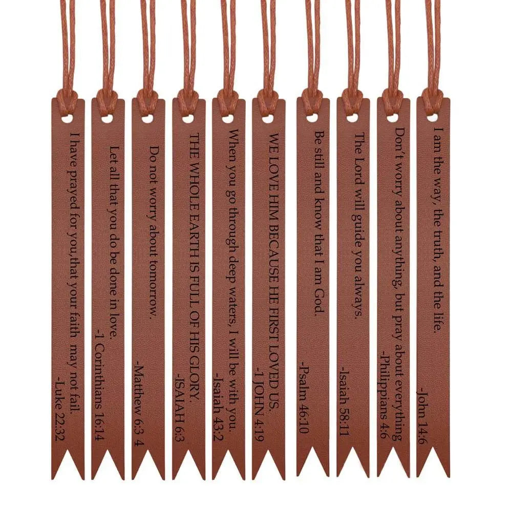 A set of brown leather bible bookmarks with various scripture verses hanging from twine.
