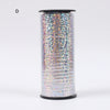 A roll of iridescent glitter curling ribbon used for gift wrapping and party decor.