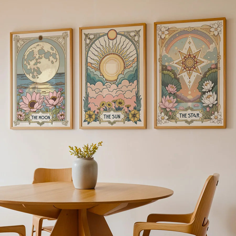 A set of three framed celestial tarot floral art prints featuring the moon sun and star designs