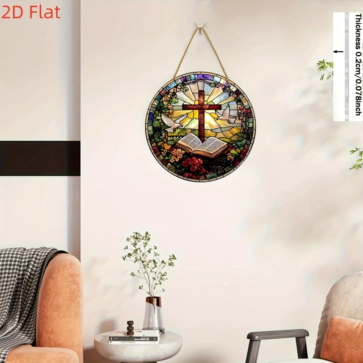 A circular stained glass art piece featuring a cross, dove, and an open book, displayed on a white wall.