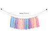 Handmade boho rainbow tassel garland featuring wooden beads in various pastel colors.