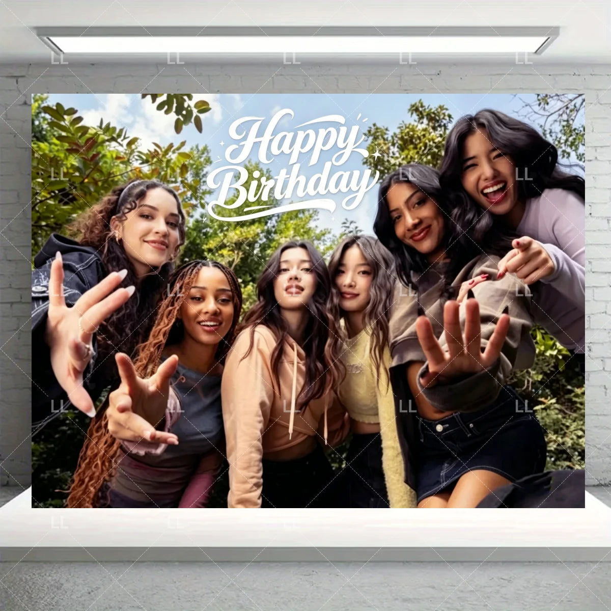 A group of six young women smiling and posing for a birthday photo in an outdoor setting.