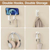 Set of four self-adhesive wall hooks used for double storage, featuring various hook shapes and colors.