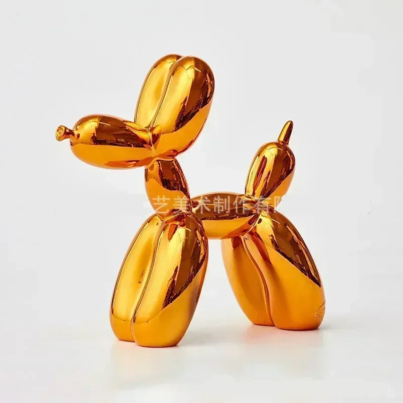 A golden resin balloon dog sculpture with a whimsical design, used as home or office decor.
