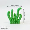 A set of three green ocean animal cake toppers, including a whale, octopus, and turtle.