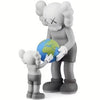 A gray stylized bear figurine holding a globe.