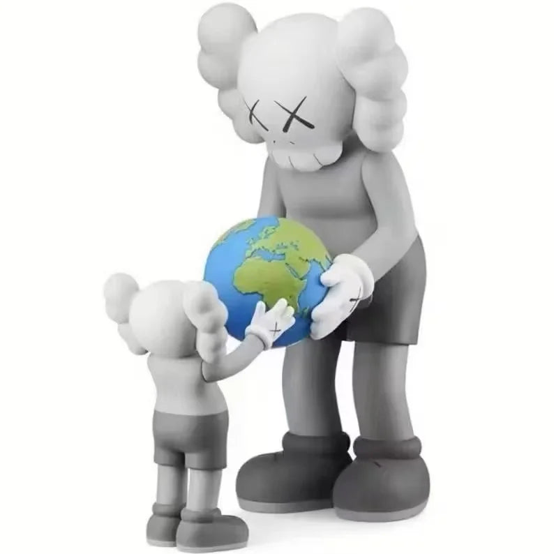A gray stylized bear figurine holding a globe.