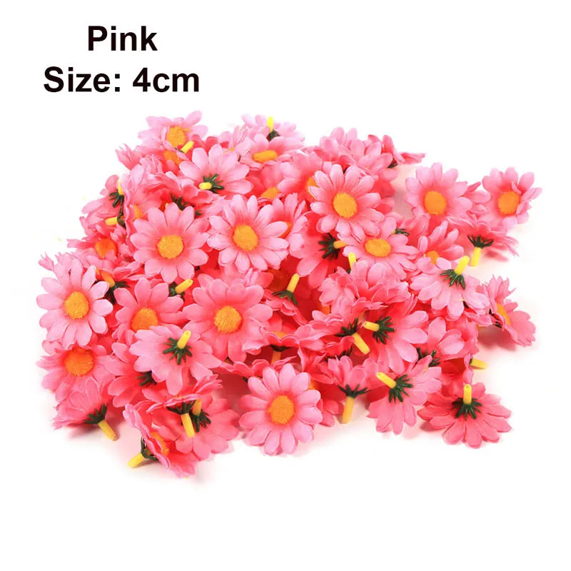 A pile of pink artificial sunflower and daisy heads, size 4cm.
