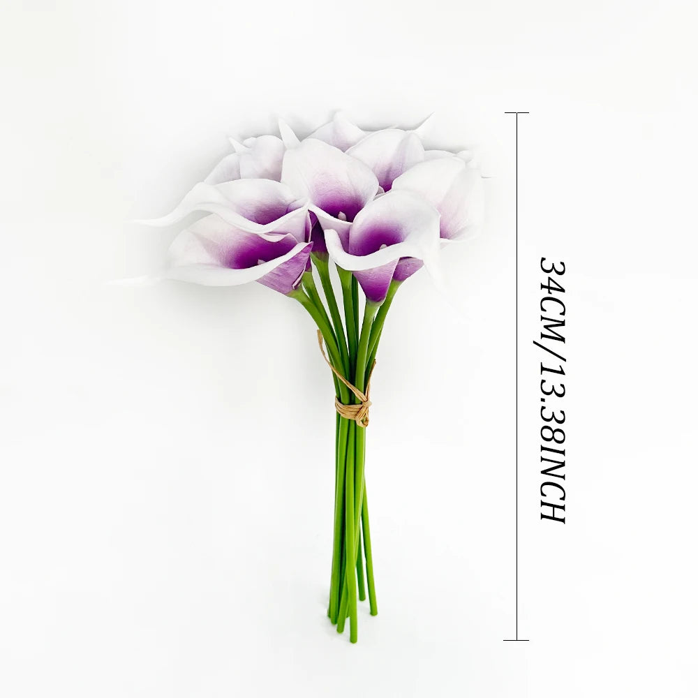 A bouquet of six artificial calla lilies with white and purple petals displayed against a white background.