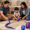 A family is playing with a purple and blue 3D movable rainbow snake fidget toy on a rug.