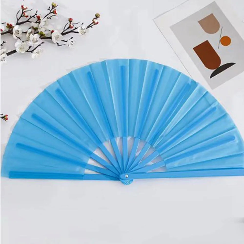 Light blue plastic Tai Chi performance fan with durable ribs shown open.