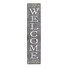 Vertical rustic metal sign with the word WELCOME carved into it and decorated with laurel leaves