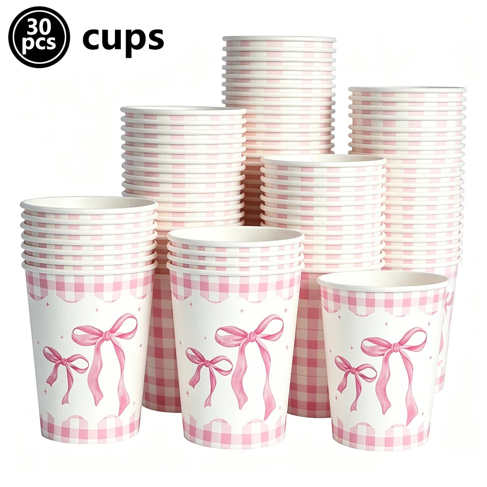 A set of 30 pink and white checkered cups with pink bows for a birthday party.