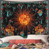 A tapestry featuring a dark background with an orange sun radiating light and various mushrooms and celestial elements.