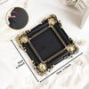 Black vintage baroque resin hanging photo frame with gold accents displayed on white fur