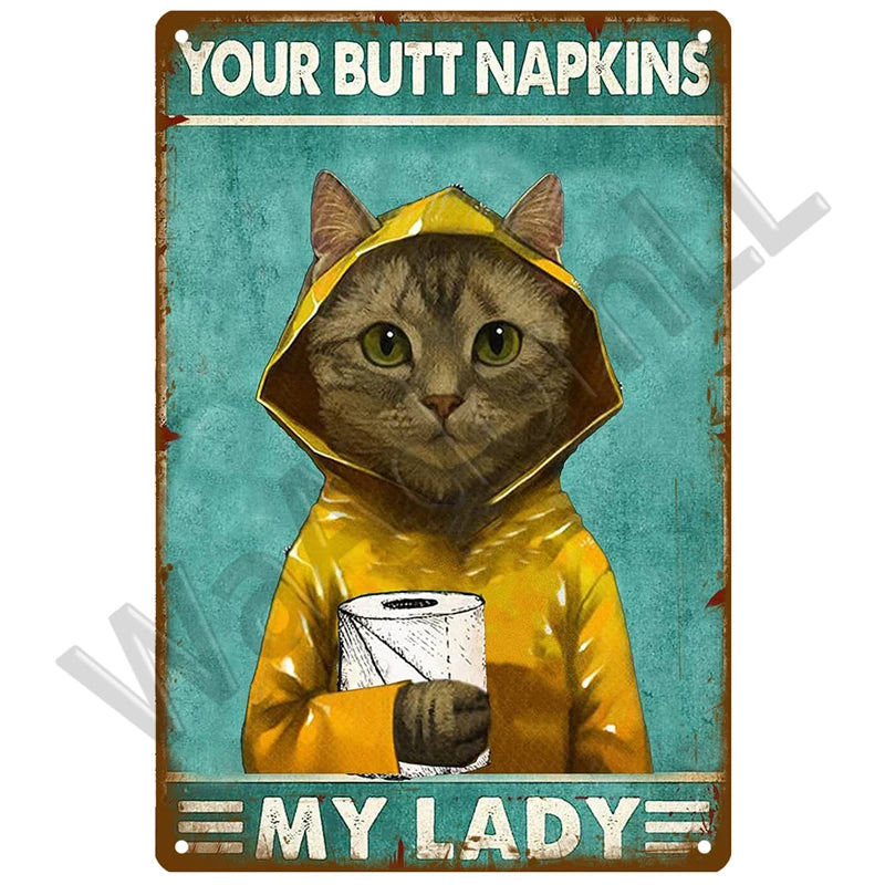 Vintage metal sign featuring a cat wearing a yellow hooded outfit and the text Your Butt Napkins My Lady
