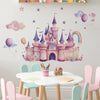 A wall decal featuring a pink castle with purple accents and a rainbow arch on a white wall.