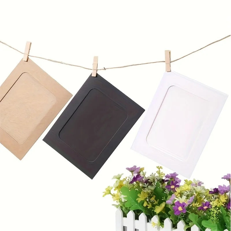 Three vintage kraft paper photo frames are displayed hanging on a line with greenery below.