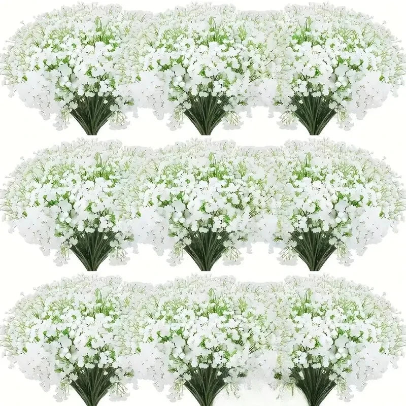 A cluster of white baby's breath artificial flowers with green stems.