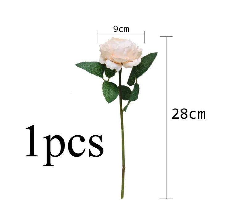 A single cream colored silk rose and peony artificial bouquet with a green stem and leaves.