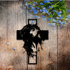 Black silhouette of a crown of thorns cross on rustic wood with blue flowers