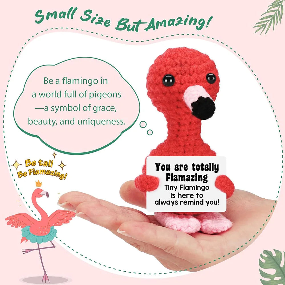 A handmade red crochet flamingo doll is shown resting on a hand, with text encouraging the viewer to be amazing.