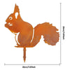 A rustic wrought iron cat ornament in orange-brown metal with a pointed base.