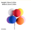 A colorful cake topper featuring spherical balloons in white, red, yellow, purple, and orange.