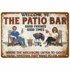 A vintage metal sign welcoming guests to The Patio Bar with text about good friends and good times.