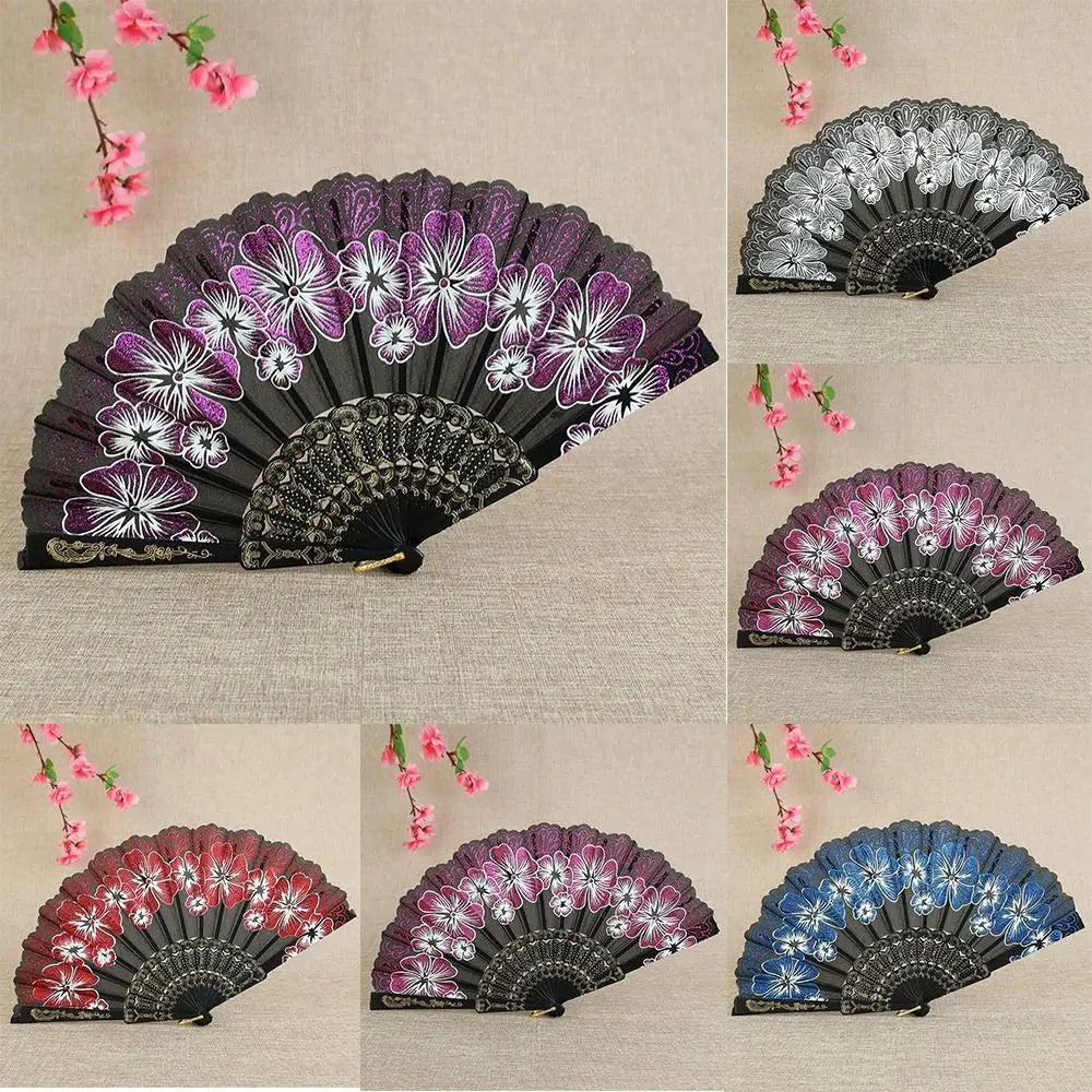A collection of antique folding fans featuring intricate floral patterns in purple, silver, and blue shades.