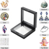 A display frame featuring various jewelry items including a brooch, coin, stone, earrings, rings, fake nails, and a toy model