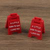 Two red 3D lettering signs shaped like houses, each engraved with the text I love you