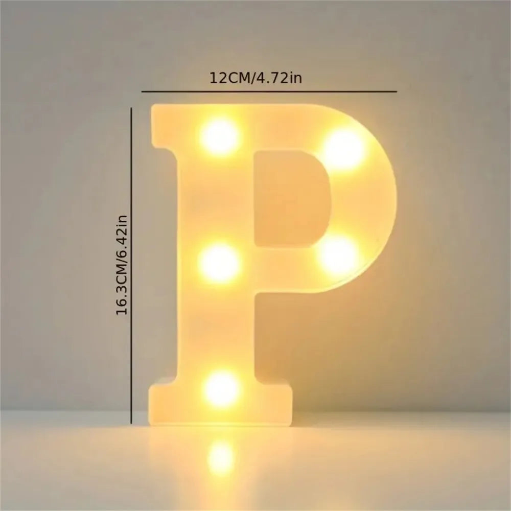 A glowing yellow LED letter P sign illuminates a surface, used for room or party decor.
