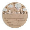 A natural wood birth announcement plaque featuring a hot air balloon, clouds, and stars with space for name, date, time, weig
