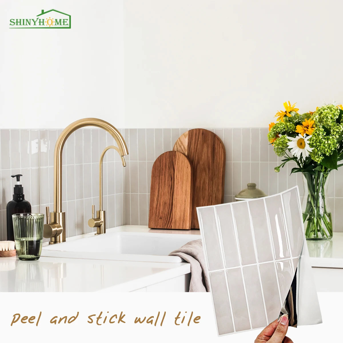 A close-up of peel and stick wall tiles displayed next to a modern kitchen sink and faucet.