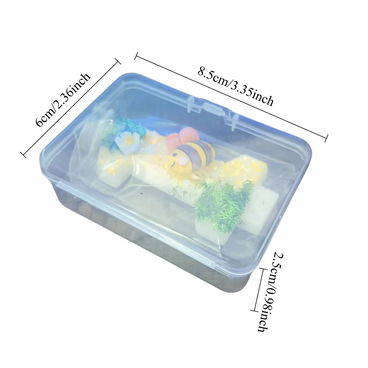 Clear plastic container holding various birthday candles shaped like bees and other yellow and white candles