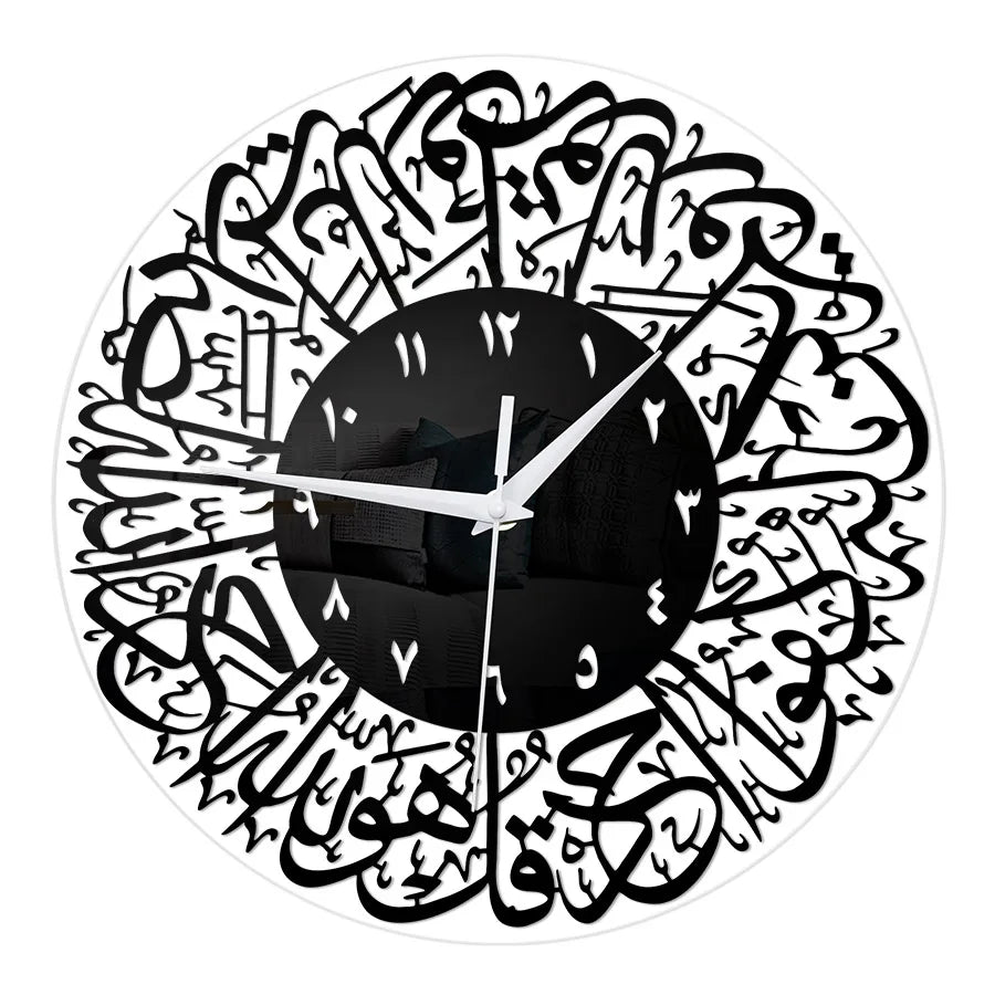 A black and white acrylic wall clock featuring intricate Arabic calligraphy designs around the face.