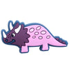 A set of twelve cartoon dinosaur PVC shoe charms featuring purple and pink dinosaurs.