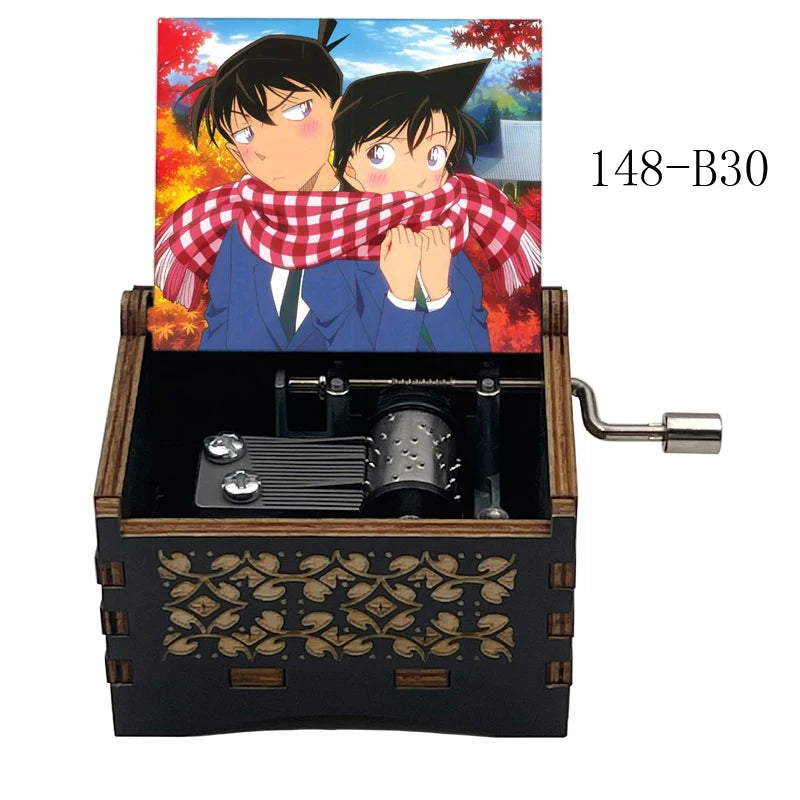 A wooden music box featuring an anime scene of two characters and a red plaid shirt.