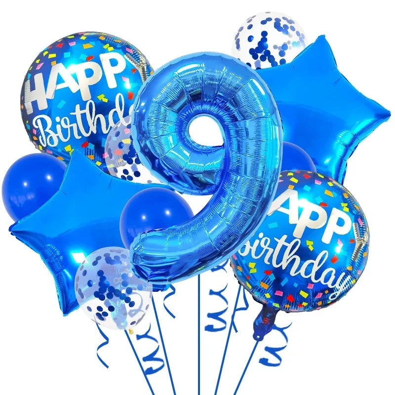 A set of navy and gold foil balloons shaped like the number nine and a star for a birthday celebration