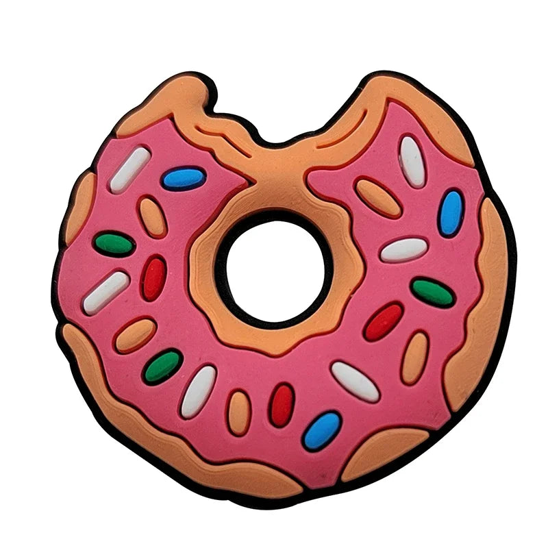 A pink doughnut shaped charm with colorful sprinkles for Crocs and slides
