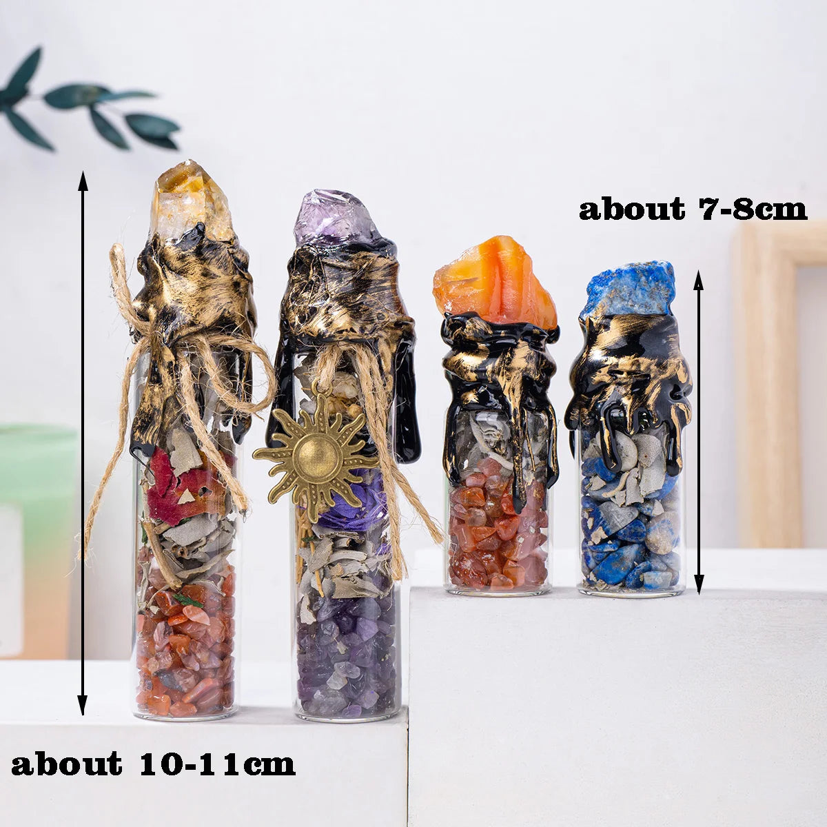 Three glass bottles filled with natural crystals and raw stones, showing various colors like amethyst, orange, and blue.