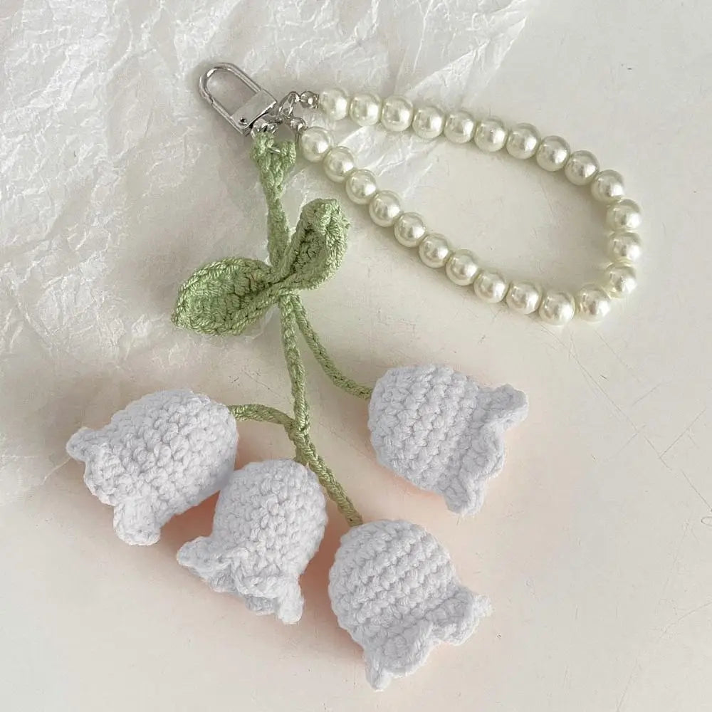 Handmade pearl chain orchid key ring with a light green crocheted flower attached