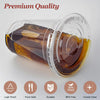 Clear plastic disposable cup with a lid and straw filled with amber liquid