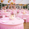 Pink stretch spandex round tablecloths set up for an elegant event with pink balloons and floral decorations