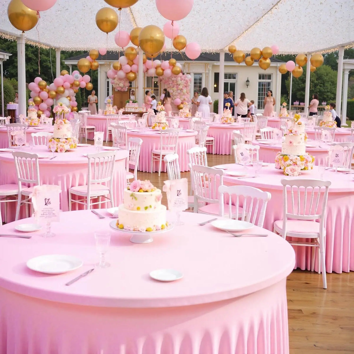 Pink stretch spandex round tablecloths set up for an elegant event with pink balloons and floral decorations