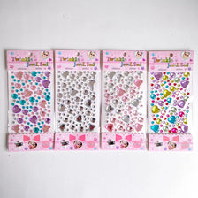 A collection of Twinkle Jewel Seal crystal gemstone stickers in various colors and shapes packaged in individual sheets.