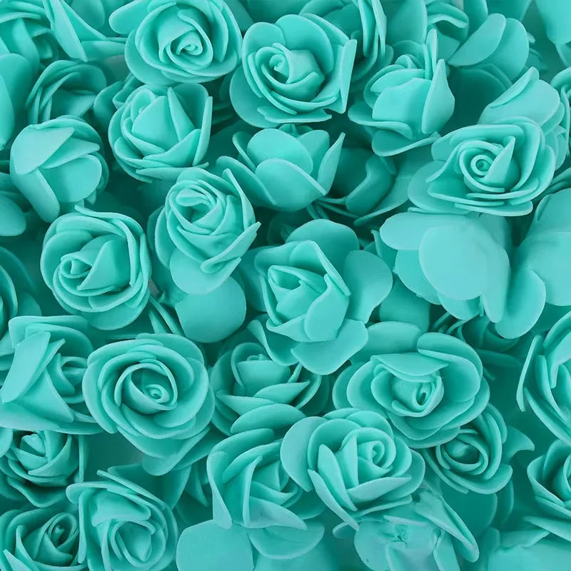 A bulk pack of realistic teal foam rose flowers for weddings and events.