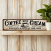 Vintage metal sign with text Coffee with Cream Served with a pastry of your choice on a wooden surface