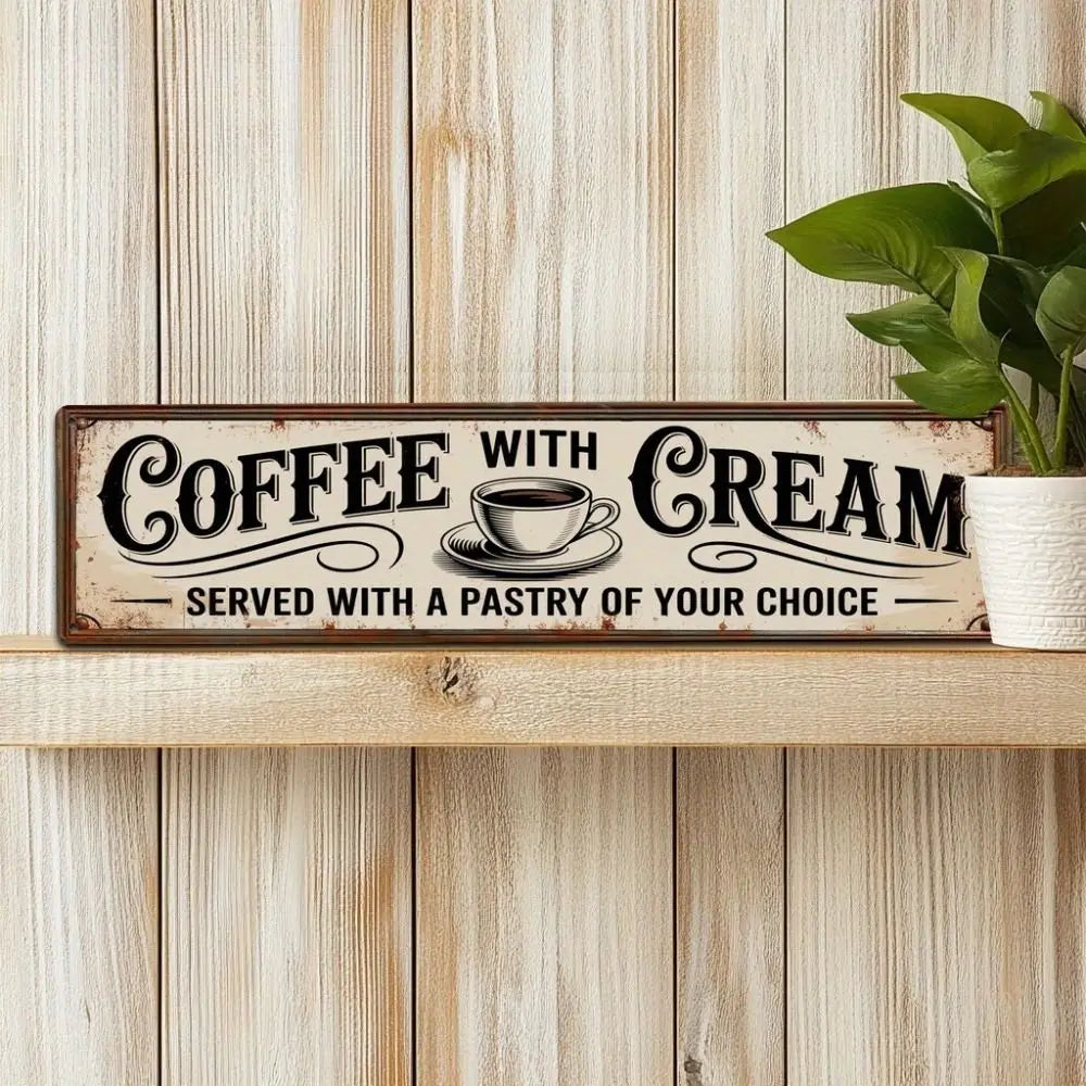 Vintage metal sign with text Coffee with Cream Served with a pastry of your choice on a wooden surface
